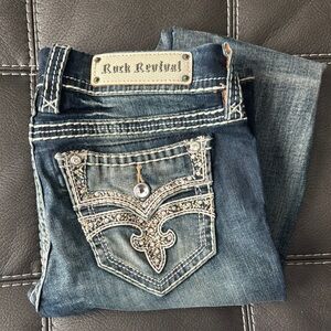 Rock Revival Blue Boot Cut Jeans with Ornate Design